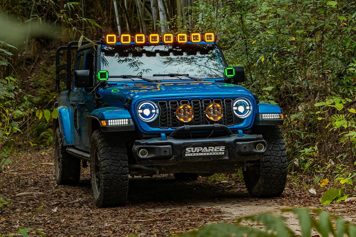 Hyper 5 RGBW 5 inch LED pod lights in a linked roof light bar setup with green A pillar accent lights on a blue off road Jeep