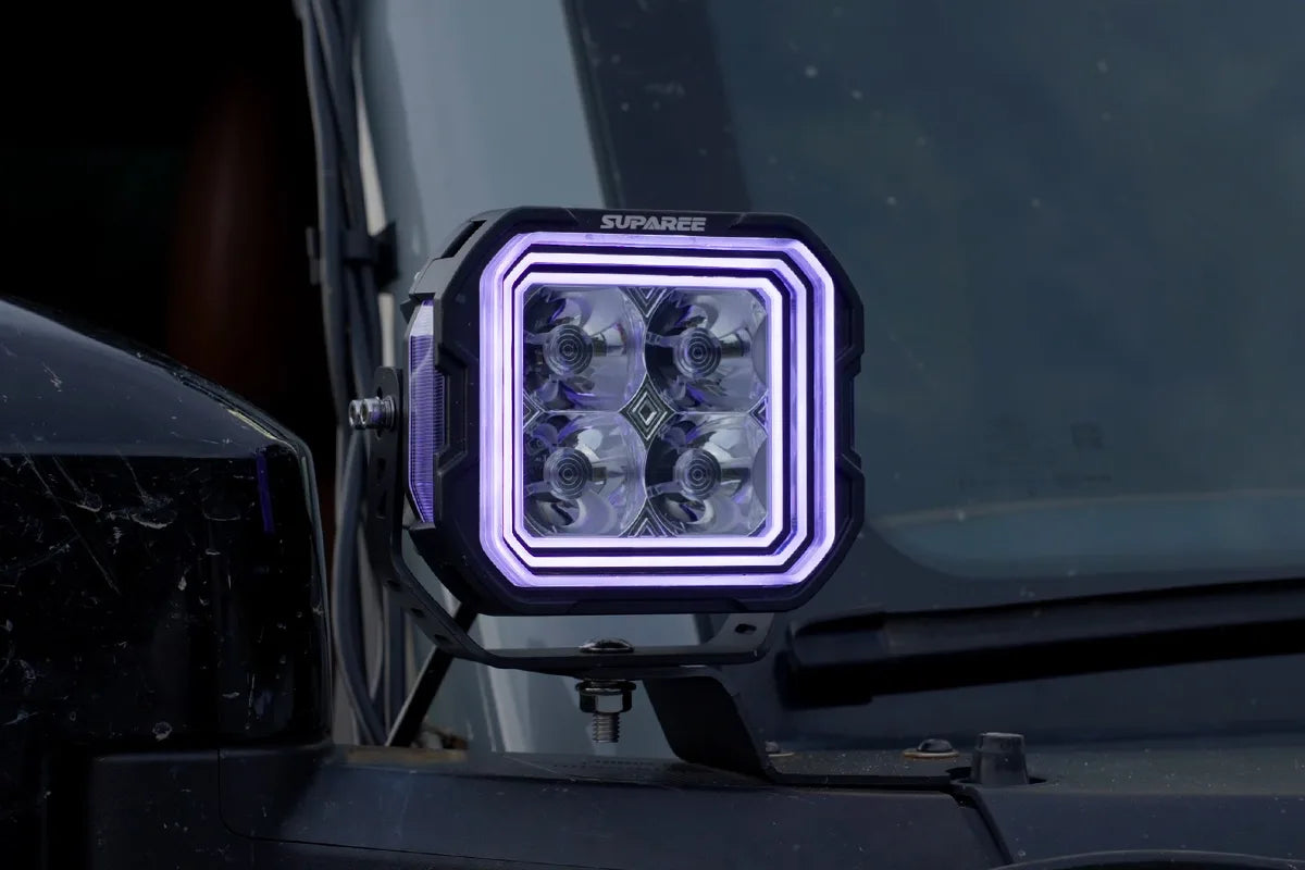 Hyper 5 RGBW 5 inch LED pod light with purple three layer accent backlight mounted on an off road vehicle