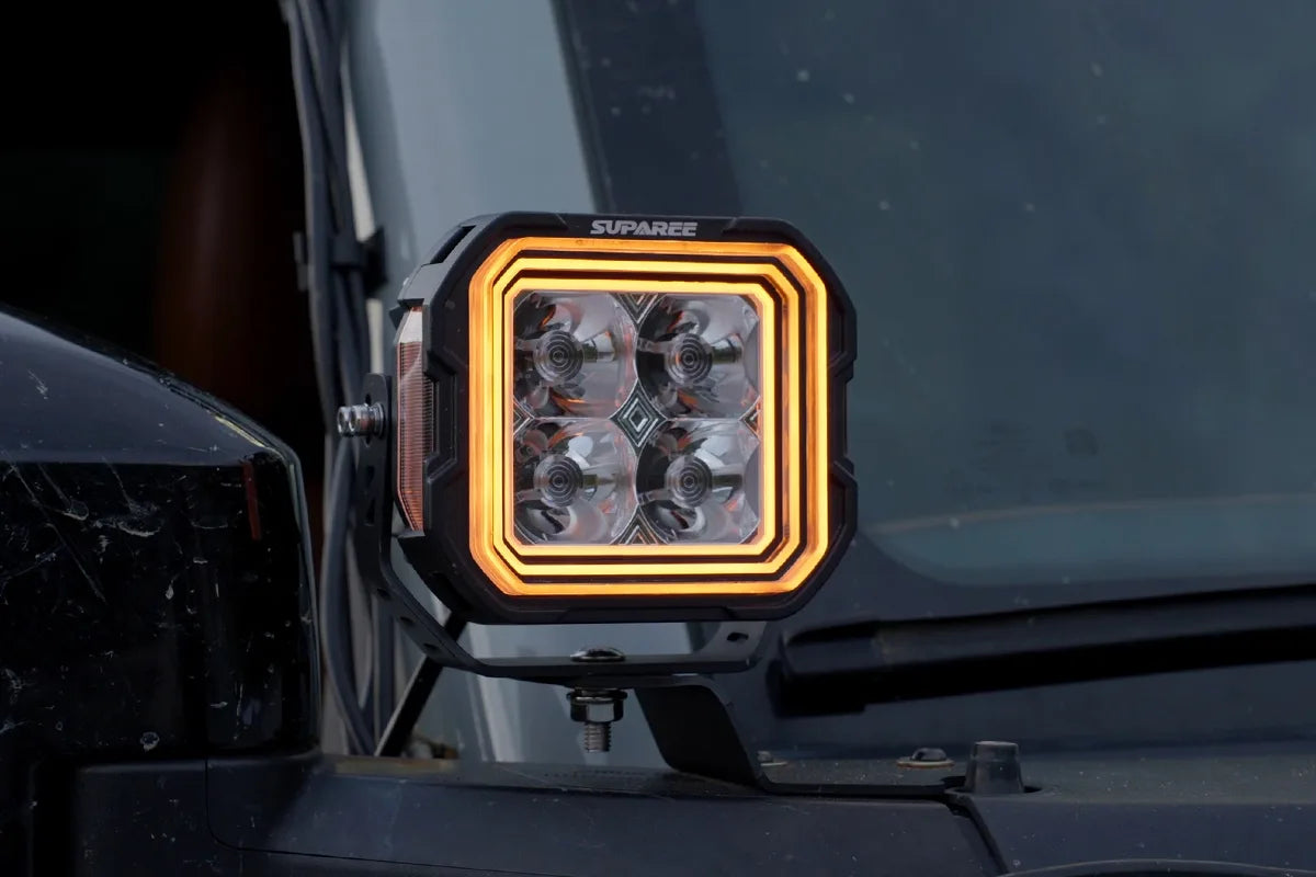 Hyper 5 RGBW LED pod light with amber three layer accent backlight on an off road vehicle