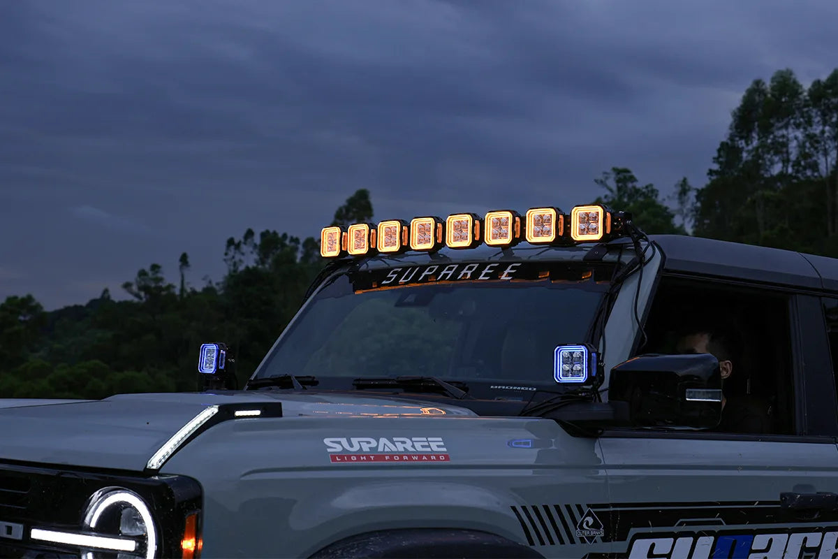 Multiple Hyper 5 RGBW 5 inch LED pod lights in a linked roof light bar setup on a gray off road Jeep