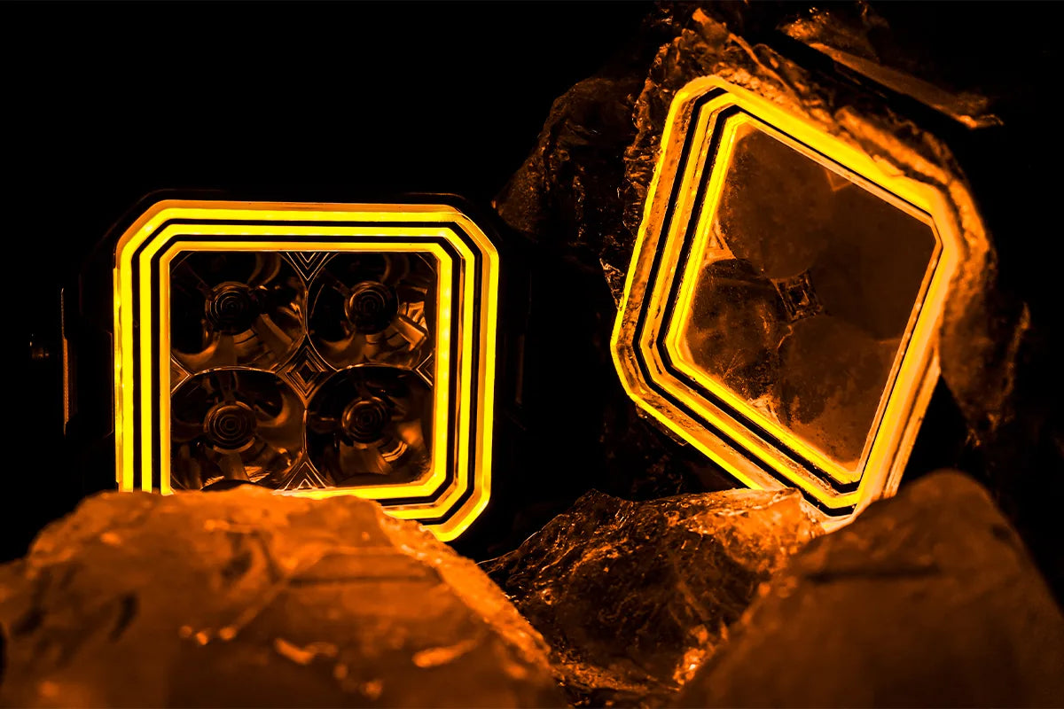 Pair of Hyper 5 RGBW LED pod lights with amber three layer accent lighting on rocks